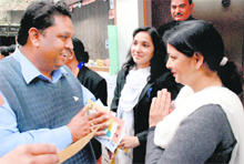 A candidate seeks votes in her favour during the Dehradun Bar Association elections held in Dehradun on Monday. 