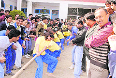 Students participate in a tug-of-war contest during the annual week celebrations of the the Dolphin (PG) Institute of Bio-medical and Natural Sciences in Dehradun on Monday. 