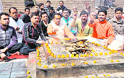 Teerth purohits hold a buddhi-shuddhi yajna for Chidanand Muni in Haridwar on Monday