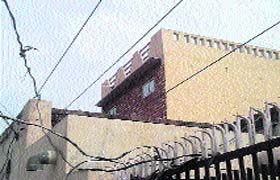 High-tension wires cross over the rooftop of a house in Subhash Nagar, Jhajjar