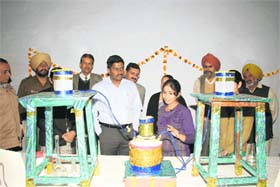 Deputy Commissioner J. Ganeshan looks at models during a science exhibition at Government National Postgraduate College in Sirsa