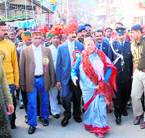 Governor Urmila Singh takes part in the concluding procession of the Shivratri fair in Mandi on Monday.