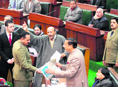 Langate MLA Engineer Abdul Rashid being led out of the Legislative Assembly over the Afzal Guru issue in Jammu on Monday.
