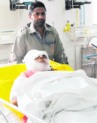 Robbery victim Prem Lata at the DMCH hospital in Ludhiana on Monday.