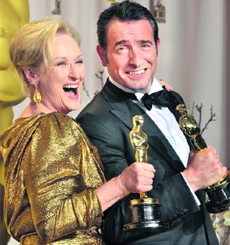 Best Actress in a Leading Role Meryl Streep and Best Actor in a Leading Role Jean Dujardin celebrate their Oscars in the press room at the 84th Annual Academy Awards in Hollywood on Sunday. 