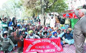 Postal staff stage their stir outside the Head Post Office