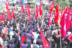 Members of labour unions hold a protest against anti-labour polices of the UPA government at Chandracharya chowk in Haridwar