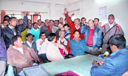Power employees hold a protest against the alleged beating up of one of their colleagues by a city councillor in Dehradun