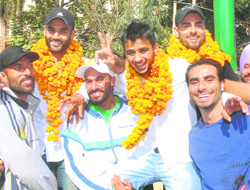 Fans greet hockey players Gurwinder Singh Chandi, Sarwan Deep Singh and Manpreet Singh in Jalandhar on Tuesday. 