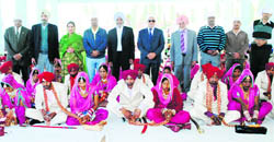 Couples during a mass marriage held near Jagraon