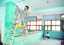 The walls of rain basera in Karam Singh Medical Ward get a new look in Amritsar on Wednesday. 
