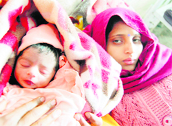 Arti with her son born on the Leap Day in Amritsar on Wednesday. 