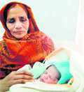 Balbir Kaur with her great granddaughter, born on February 29. 