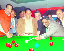  MLA Anil Joshi tries his hand at snooker after inaugurating a snooker and pool playing centre on Lawrence Road in Amritsar on Wednesday. Club Billiard Royal Academy opened the centre. ML Lakhan Pal of the club said a coach has also been arranged to impart training in the game to new players.