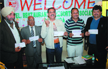 Members of the Hotel and Restaurant Association of Bathinda showing the cheques they have received to clear their pending dues for the services rendered during the Kabaddi World Cup in Bathinda on Wednesday. 