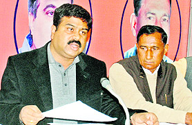 Dharmender Pradhan, BJP general secretary and state election in charge, addresses a press conference in Dehradun on Wednesday.