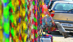 A hammock seller awaits customers on the Akhnoor road near Jammu 