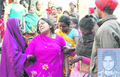 Neighbours console Urmila, mother of Khushboo (6), who was strangled to death by Jai Pal (inset) in Globe Colony, near Gujapeer road, in Jalandhar 