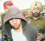 Jassa, an accused in the Kartarpur rape case, being taken to a court in Jalandhar