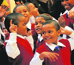 Children dance at a party organised by an English learning institute.