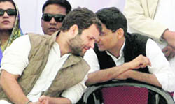 Congress general secretary Rahul Gandhi with MP Deepender Singh Hooda at an election meeting at Swaar Tanda in Rampur