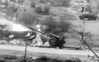 An image grab shows a Syrian army gun purportedly firing towards Zabadani.  AFP