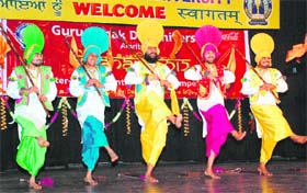 Students perform bhangra during Jashan-2012 at GND University in Amritsar on Thursday
