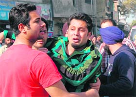 Victims husband Gurdev Singh being consoled by relatives