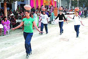 Students take part in a track event during the annual athletic meet organised at the SSD Girls College in Bathinda on Thursday.