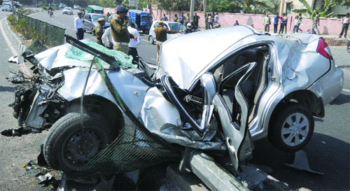 The mangled remains of a car that met with an accident on Pusa Road in New Delhi on Thursday. Two persons were injured in the mishap. 