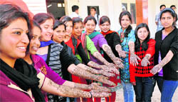 Students of DBS College participate in a mehndi competition in Dehradun 