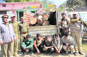 A forest team with the alleged smugglers in Haridwar on Thursday