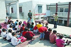 Primary students of Goverment School, Gandhi Camp, attend classes in an unsafe verandah on the first floor of the building in Jalandhar.