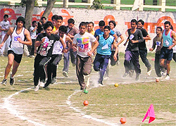 Boys take part in the 1500m race on the opening day of the annual athletics meet at Arya College in Ludhiana on Thursday