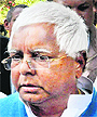 RJD chief Lalu Prasad talks to the media after appearing in a court in Patna on Thursday. 