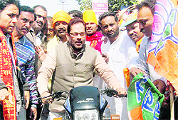 BJP leader Mukhtar Abbas Naqvi at a road show in Rampur on Thursday.