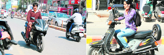 A youngsters riding a motorcycle without on the wrong side of the road; and using mobile phone while driving in Amritsar on Friday