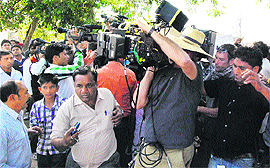 Vishwa Hindu Parishad and Shiv Sena activists stop a Hollywood crew from shooting a film near the Mani Majra market, Chandigarh, on Friday. 