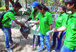 Students of Dayal Singh College take part in a cleaning drive at the Faculty of Art in New Delhi 