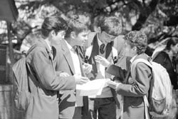 Students discuss their question paper after appearing in a CBSE examination in Shimla 