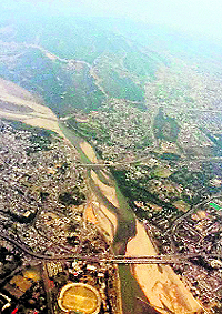 An aerial view of the Tawi crossing Jammu town. Also seen are two bridges over the river