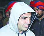 Singer KS Makhan in police custody in Jalandhar on Friday. 