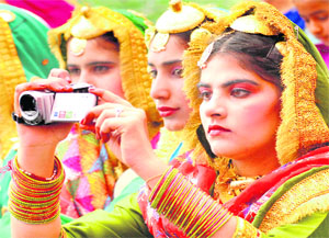 A girl captures the cheerful moments in a camera on the second day of the 15th Inter-polytechnic Youth Festival for Girls in Jalandhar on Friday.