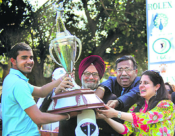 Khalin Joshi with the Samarvir Sahi Trophy at the CGC on Friday. Tribune Photo: S Chandan