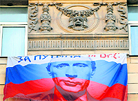 A presidential campaign poster for Russias PM Vladimir Putin in Moscow on Friday