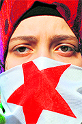 A Syrian woman attends a demonstration against Bashar al-Assad in Istanbul on Friday