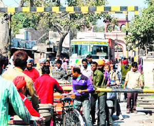 A private bus caught in the traffic jam at a railway crossing in Amritsar. 