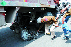 A cop examines the accident site near Fauji Chowk in Bathinda on Saturday