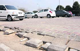 Tiles laid in the new parking lot near the district court give way at Sector 17 in Chandigarh