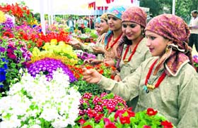 A group of Janusari girls appreciate flowers at Spring Festival-2012 at Raj Bhavan in Dehradun on Saturday